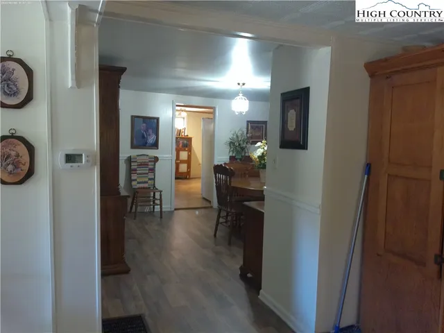 a view of dining room with furniture and wooden floor