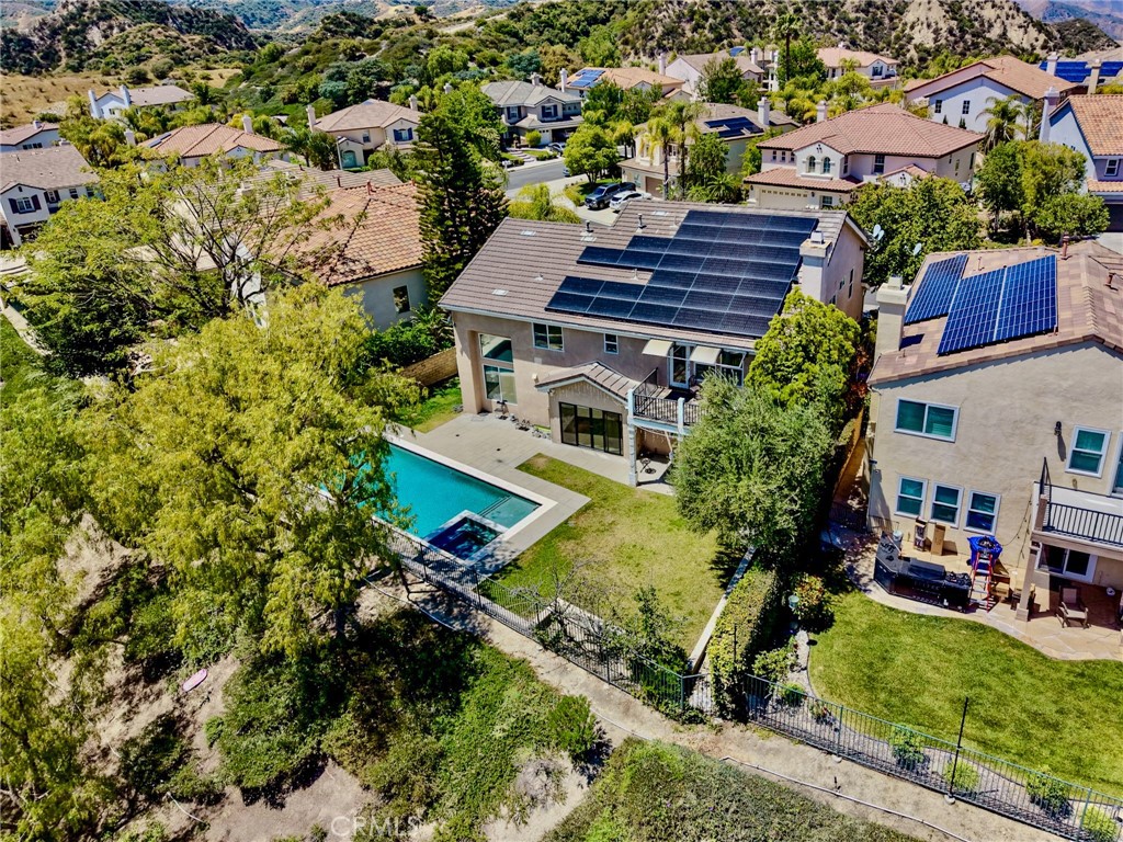 25714 Wallace Place Stevenson Ranch, CA 91381 - Photo 24 of 24 an aerial view of a house with a garden