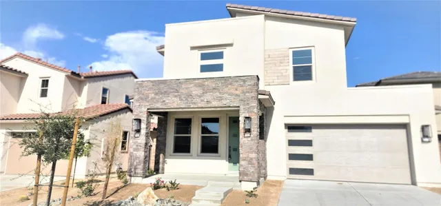 a front view of a house with a garage
