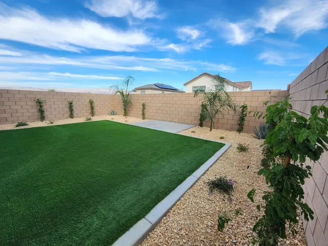 a view of a big yard with a house
