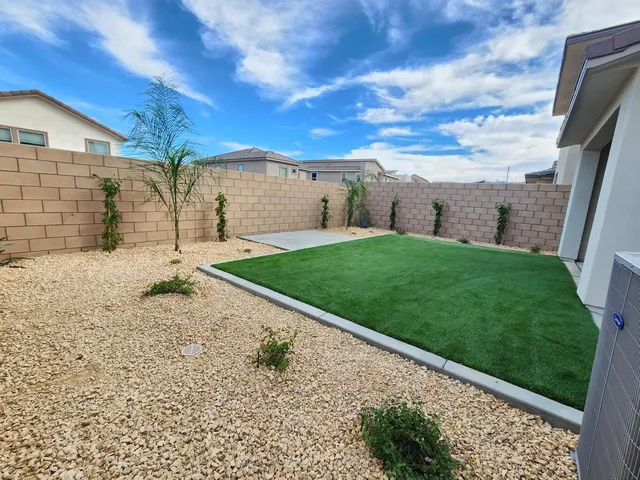 a view of a back yard of the house