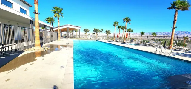 a view of a swimming pool with a patio