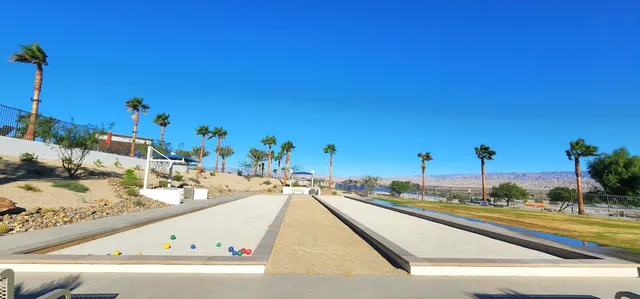 a view of a swimming pool and a lounge chair