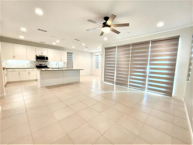 a view of a kitchen with a sink and a window