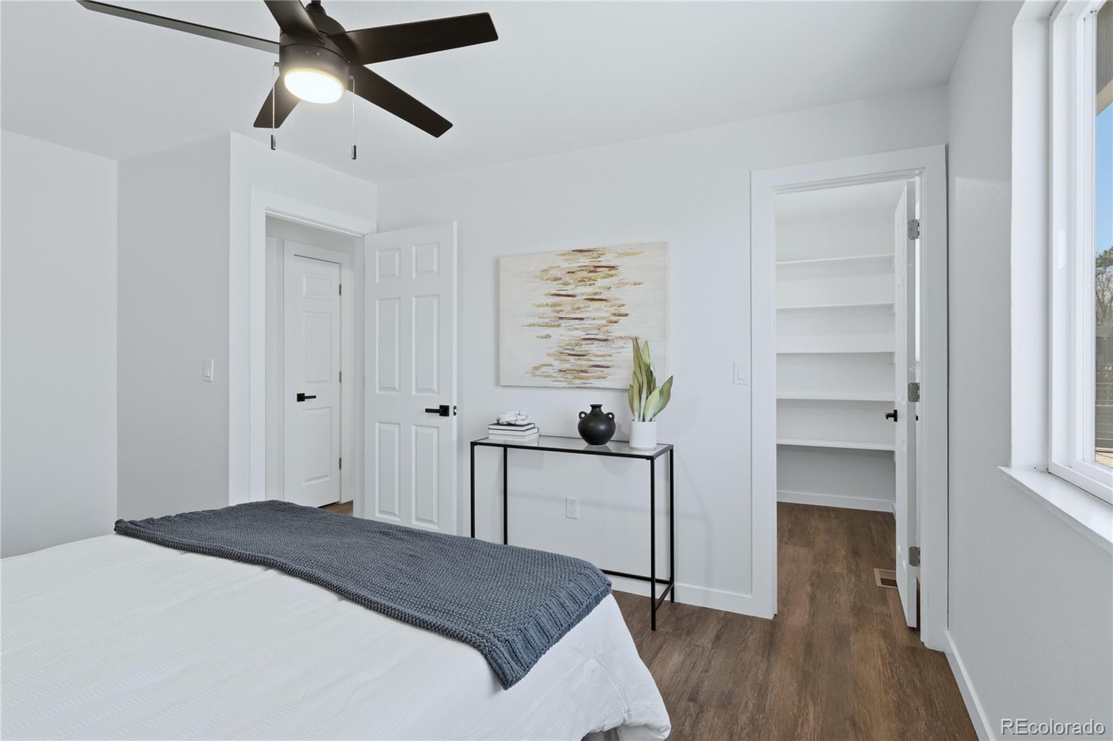 3173 South Nucla Street Aurora, CO 80013 - Photo 19 of 34 a bedroom with a bed and a window