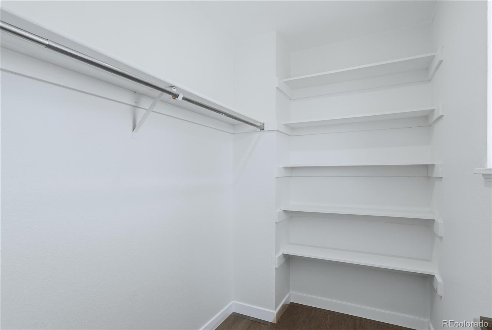 3173 South Nucla Street Aurora, CO 80013 - Photo 20 of 34 a view of an empty walk in closet