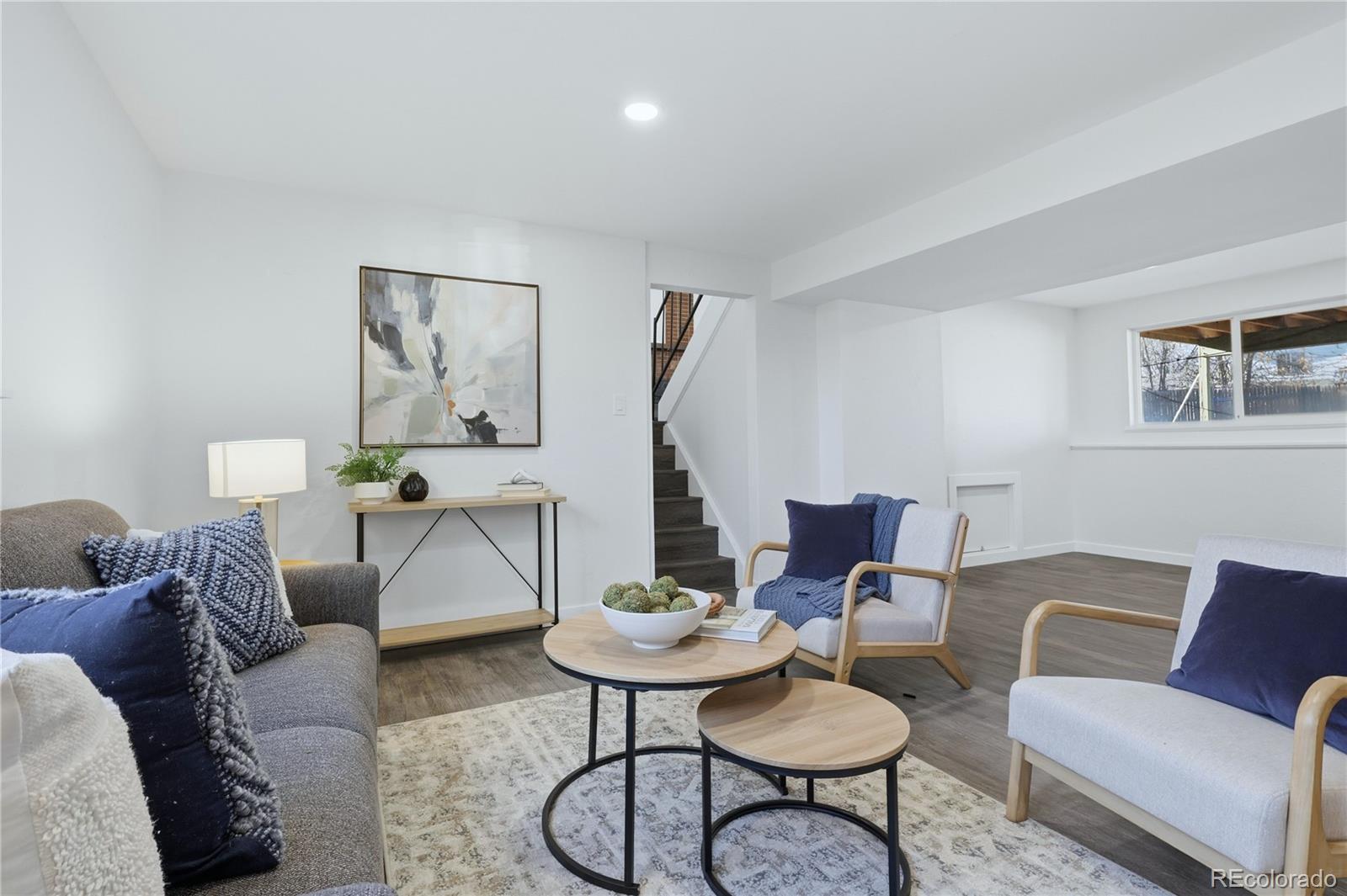 3173 South Nucla Street Aurora, CO 80013 - Photo 24 of 34 a living room with furniture and a table