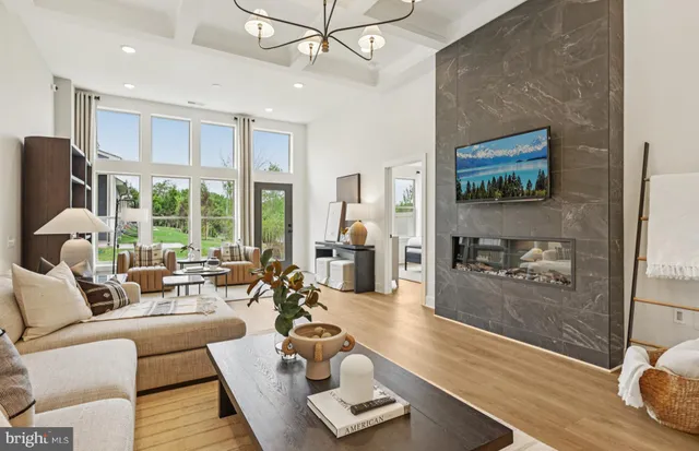 a kitchen with stainless steel appliances kitchen island a dining table and chairs
