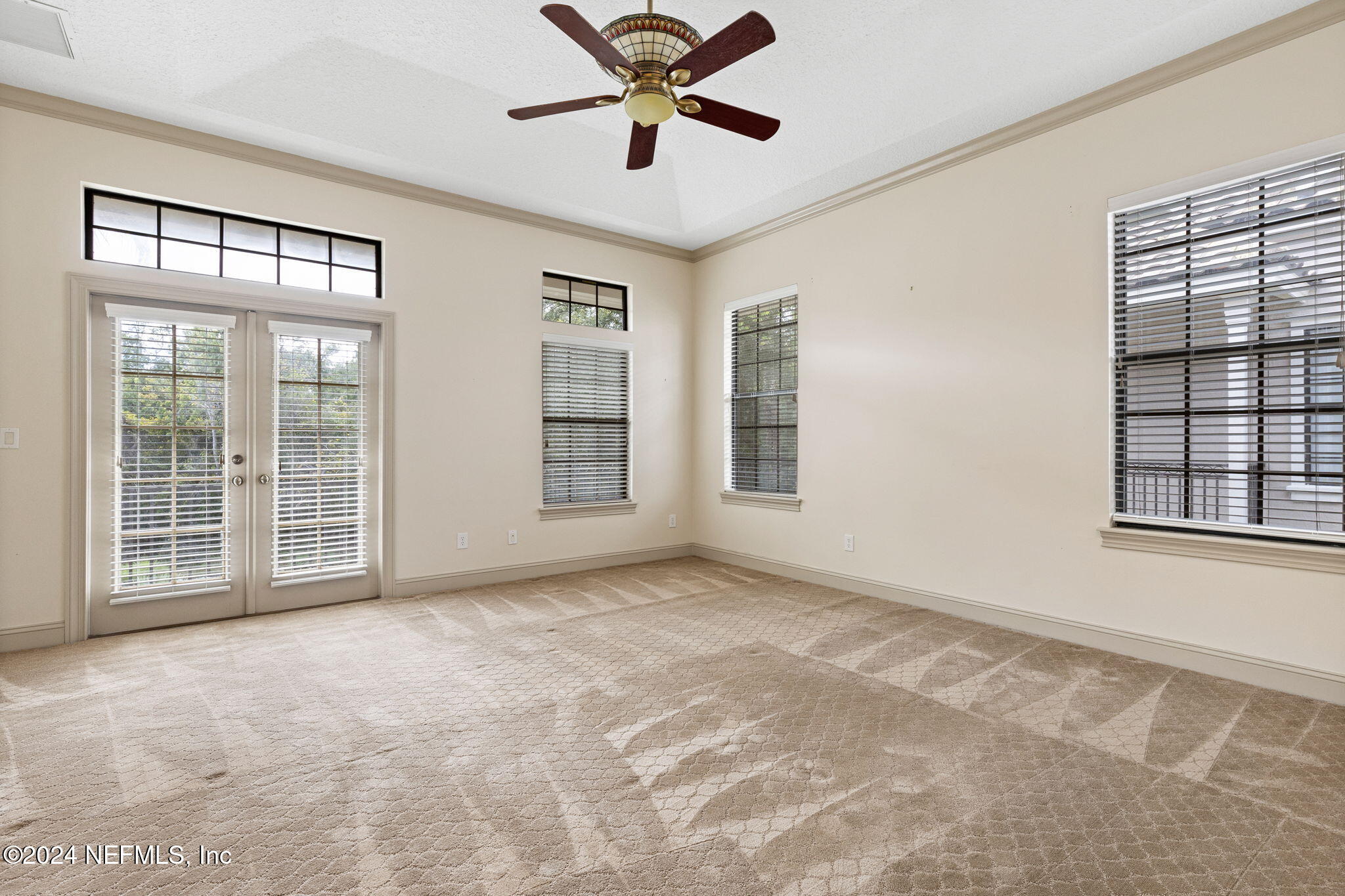 650 South Loop Parkway St. Augustine, FL 32095 - Photo 15 of 42 a view of an empty room with a window and a ceiling fan