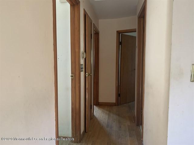 116 Oak Glen Road Howell, NJ 07731 - Photo 14 of 16 a view of a hallway with wooden floor
