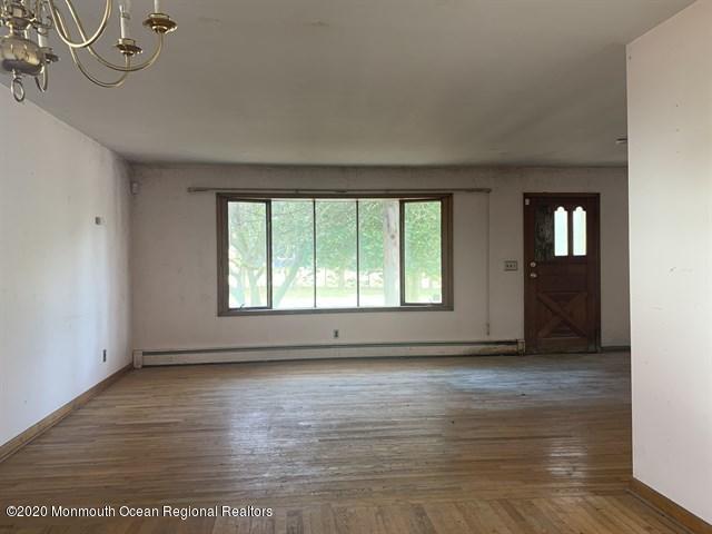 116 Oak Glen Road Howell, NJ 07731 - Photo 5 of 16 wooden floor in an empty room with a window