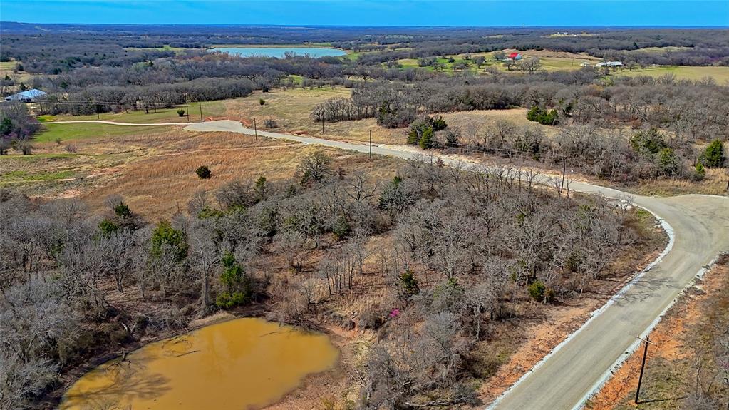 1887 Red Oak Hills Road Nocona, TX 76255 - Photo 2 of 32 a view of an ocean and mountain