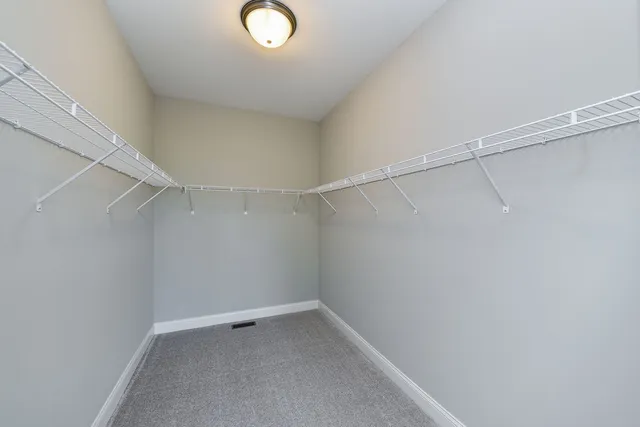 a view of an empty walk in closet