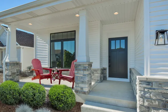 a sitting area with furniture and a window