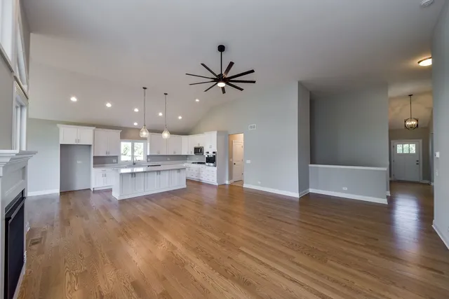 a view of a kitchen with a sink and a refrigerator