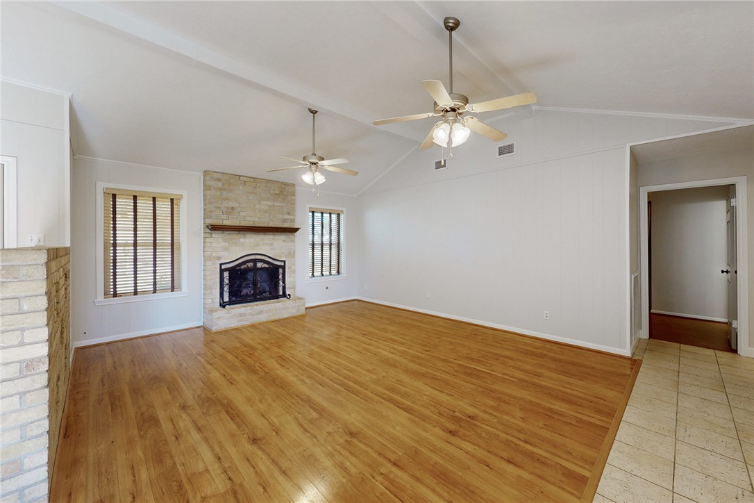 1308 Hawk Tree Drive College Station, TX 77845 - Photo 11 of 34 a view of empty room with fireplace and fan