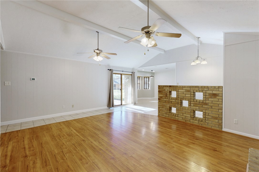 1308 Hawk Tree Drive College Station, TX 77845 - Photo 13 of 34 a view of an empty room with window and wooden floor