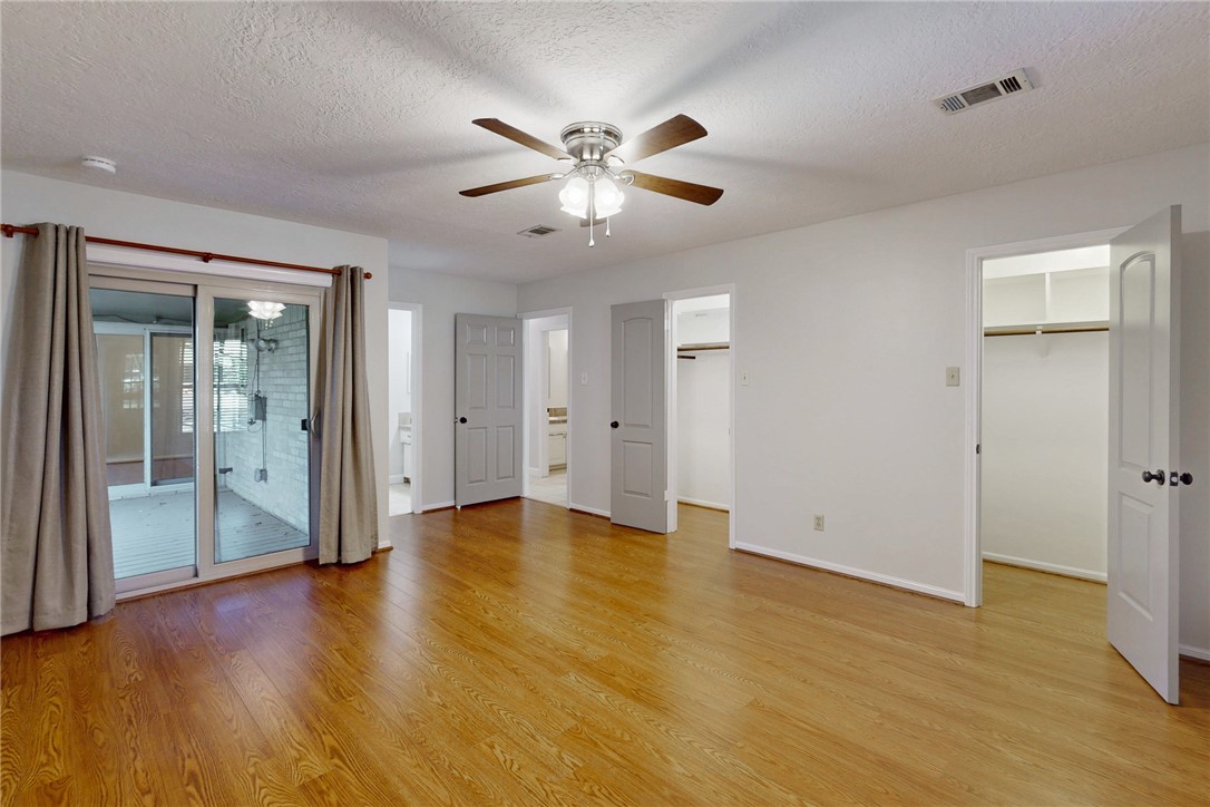 1308 Hawk Tree Drive College Station, TX 77845 - Photo 15 of 34 a view of an empty room with wooden floor