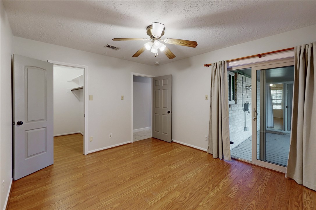 1308 Hawk Tree Drive College Station, TX 77845 - Photo 24 of 34 a view of empty room with wooden floor and fan