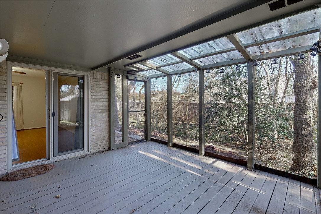 1308 Hawk Tree Drive College Station, TX 77845 - Photo 26 of 34 a view of an empty room with wooden floor and a window