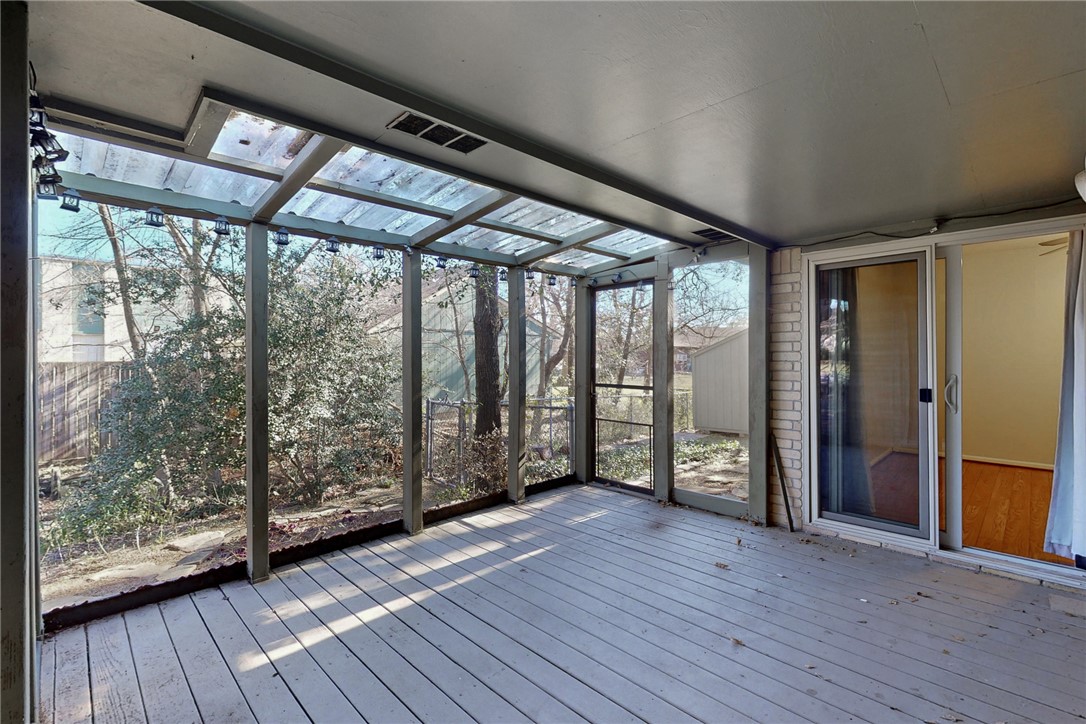 1308 Hawk Tree Drive College Station, TX 77845 - Photo 27 of 34 an empty room with wooden floor and door