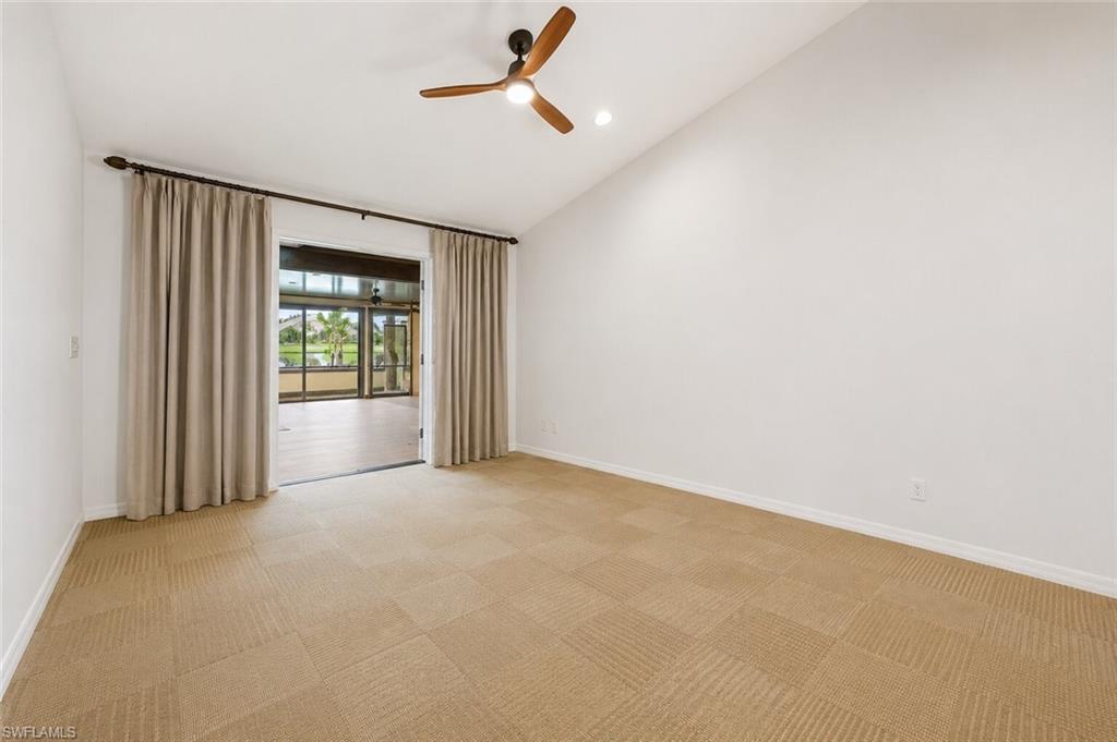 2274 Queens Way Naples, FL 34112 - Photo 7 of 28 an empty room with windows and closet