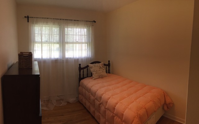 5925 107th Street Chicago Ridge, IL 60415 - Photo 11 of 21 a bedroom with a bed and wooden floor