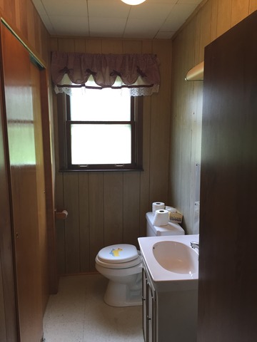 5925 107th Street Chicago Ridge, IL 60415 - Photo 14 of 21 a bathroom with a sink toilet and mirror