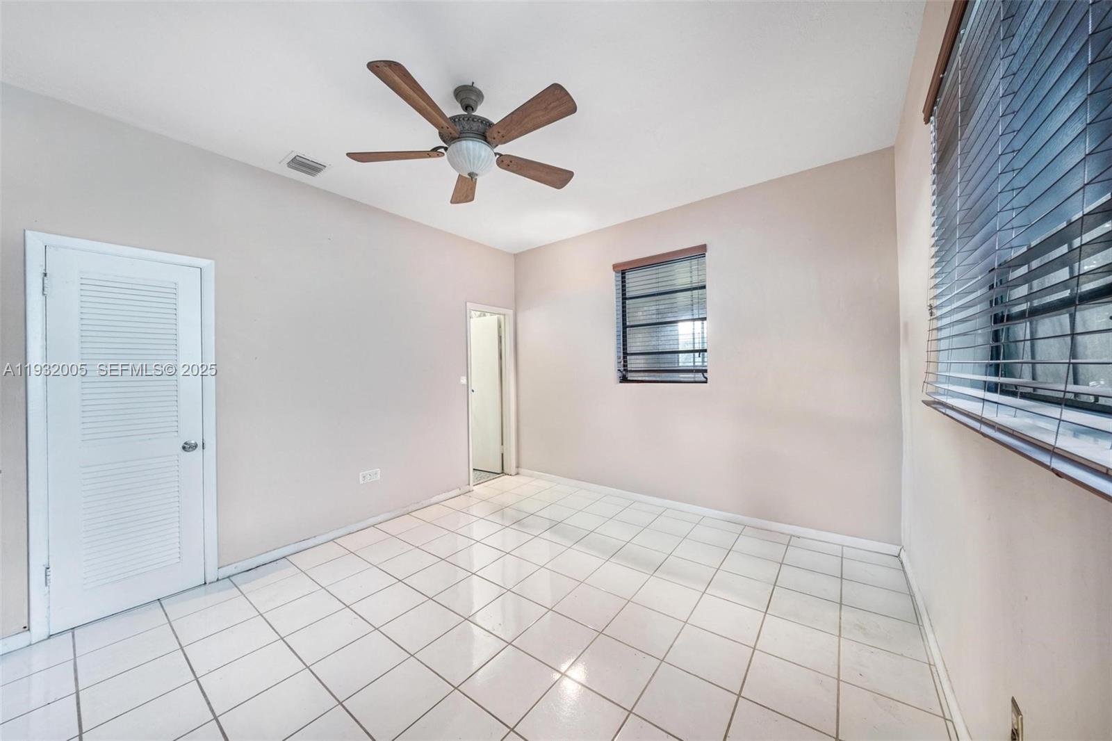 8230 Southwest 117th Terrace Miami, FL 33156 - Photo 12 of 18 a view of an empty room