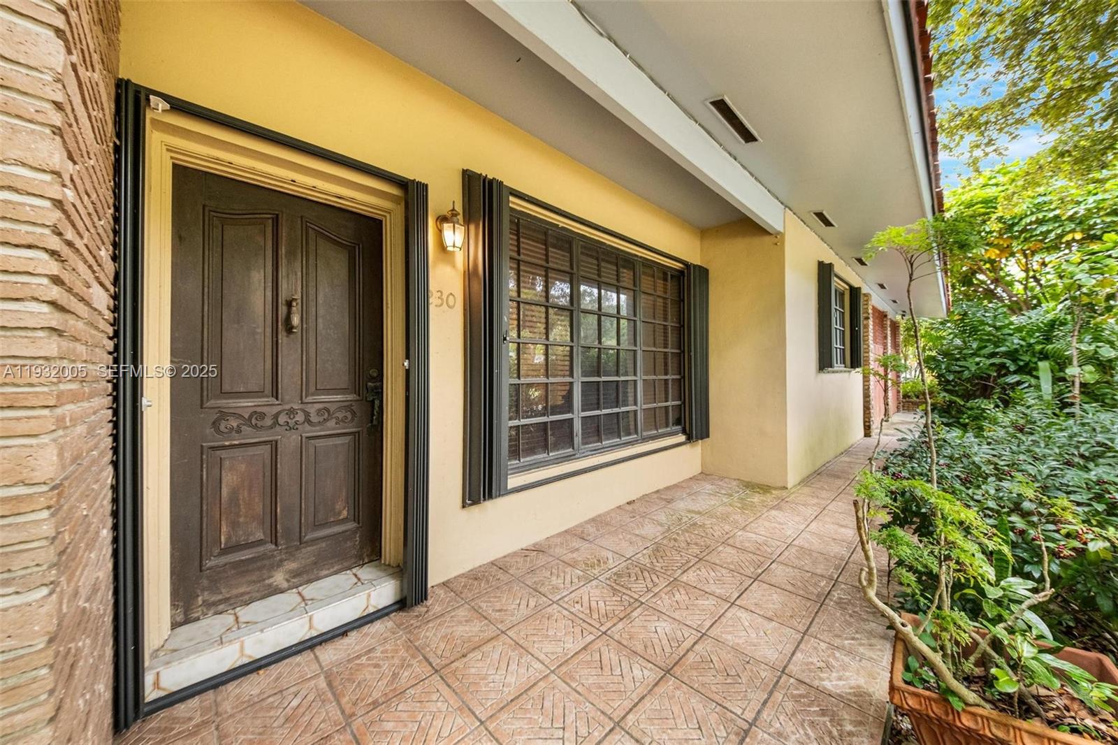 8230 Southwest 117th Terrace Miami, FL 33156 - Photo 3 of 18 a view of house with backyard