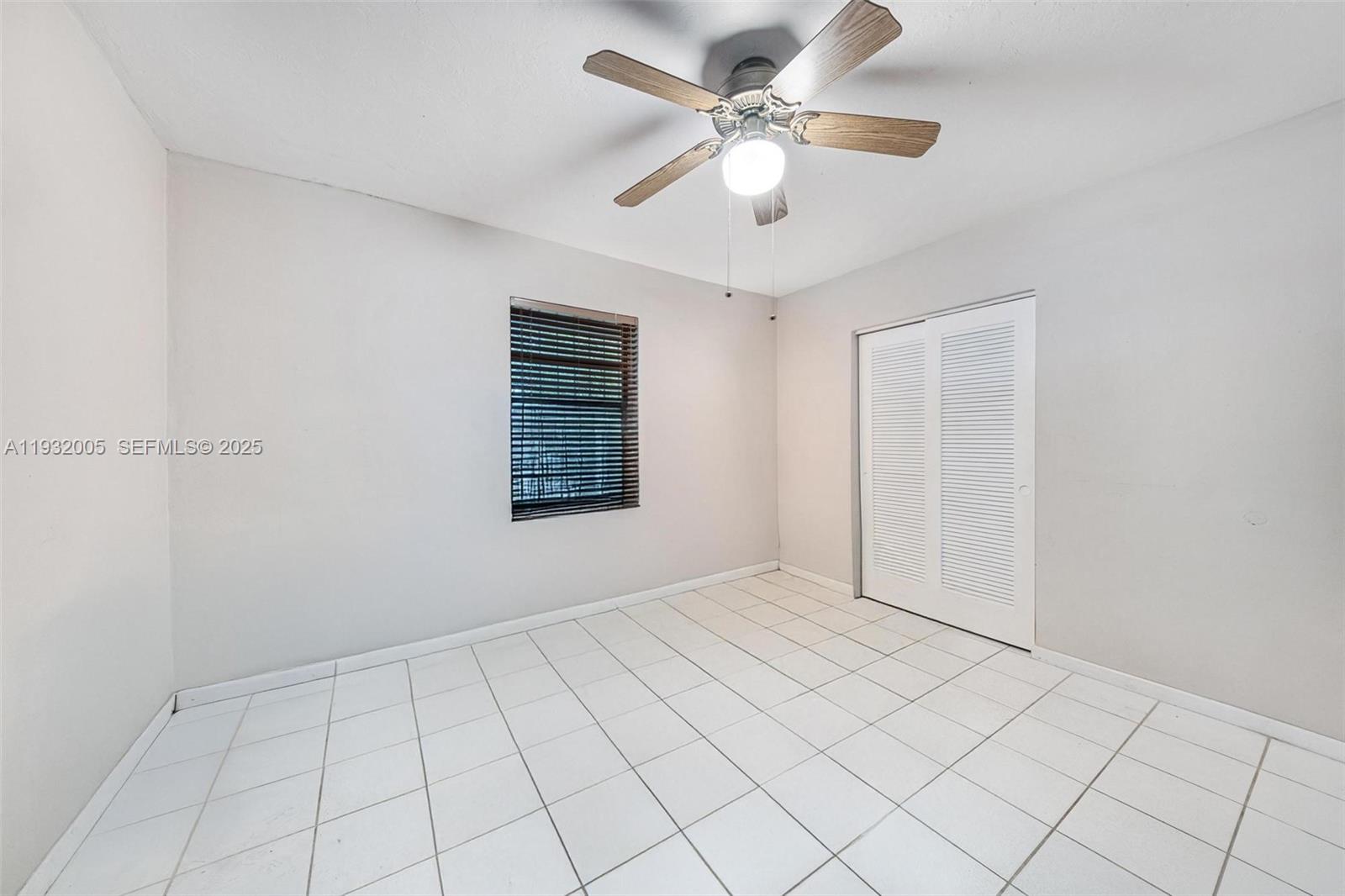 8230 Southwest 117th Terrace Miami, FL 33156 - Photo 10 of 18 a view of an empty room with a window