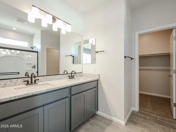 a bathroom with a double vanity sink mirror and double