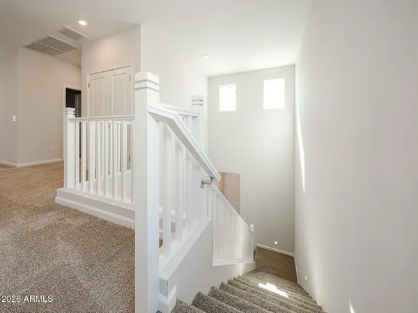 a view of entryway with wooden floor and stair