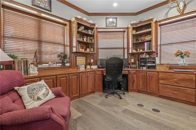 a livingroom with workspace and a window