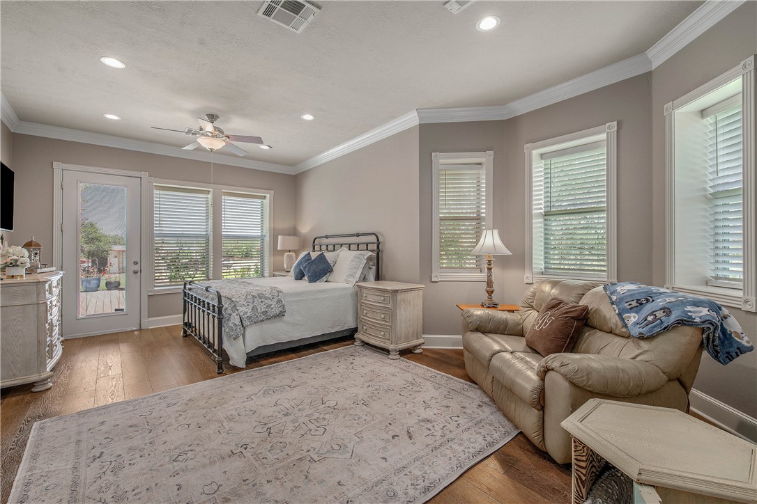 6045 Old Reliance Road Bryan, TX 77808 - Photo 13 of 50 a bedroom with furniture and a large window