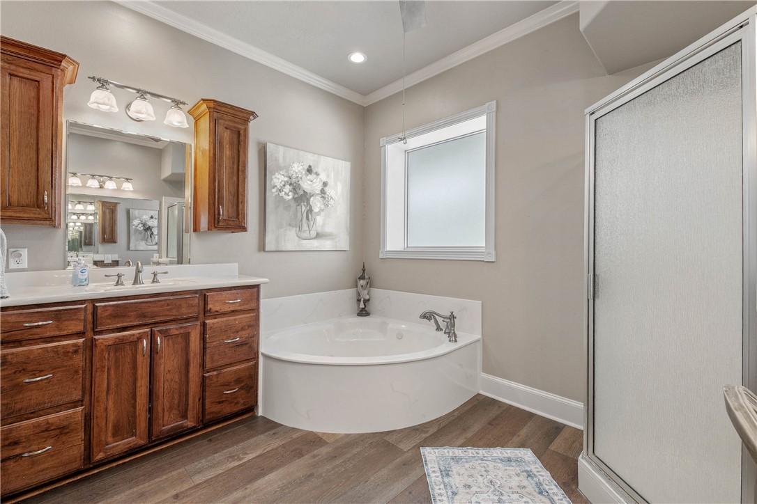 6045 Old Reliance Road Bryan, TX 77808 - Photo 14 of 50 a spacious bathroom with a double vanity sink mirror and bathtub