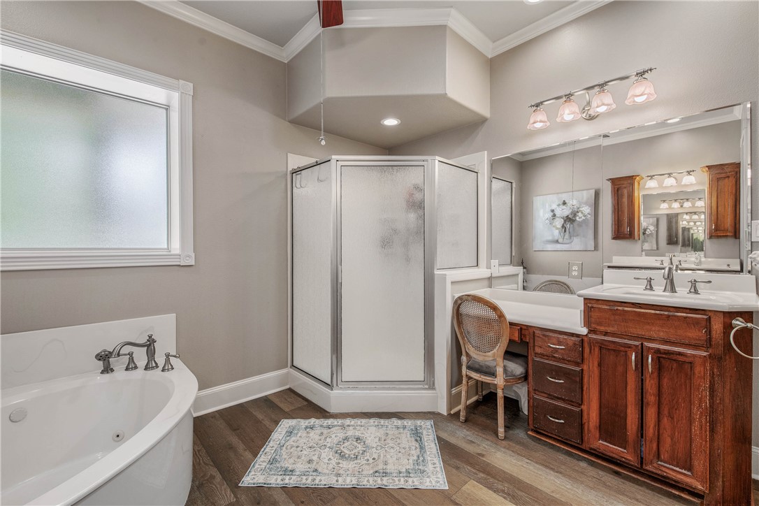 6045 Old Reliance Road Bryan, TX 77808 - Photo 15 of 50 a bathroom with a tub sink and mirror