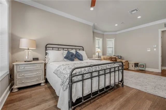 a bedroom with a bed and a night stand