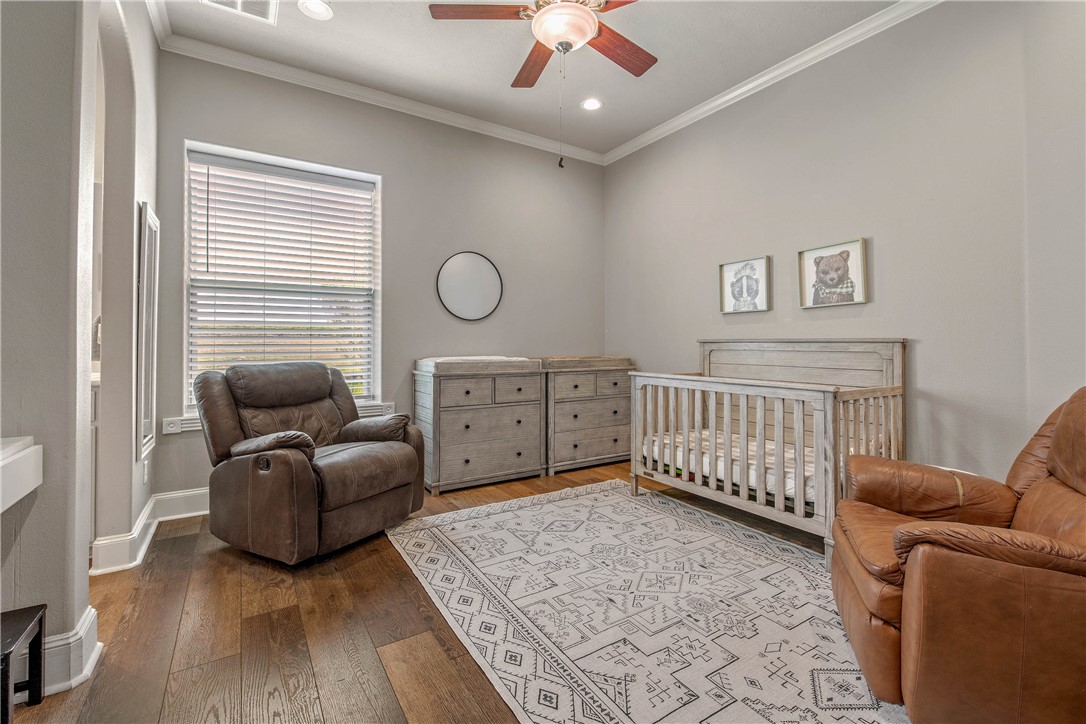 6045 Old Reliance Road Bryan, TX 77808 - Photo 21 of 50 a bedroom with furniture and wooden floor