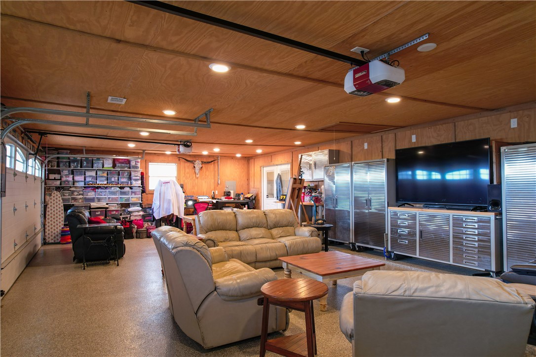6045 Old Reliance Road Bryan, TX 77808 - Photo 28 of 50 a lobby with furniture and a projector