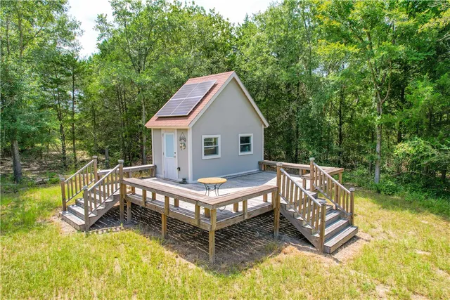 a living room with fireplace furniture and decor