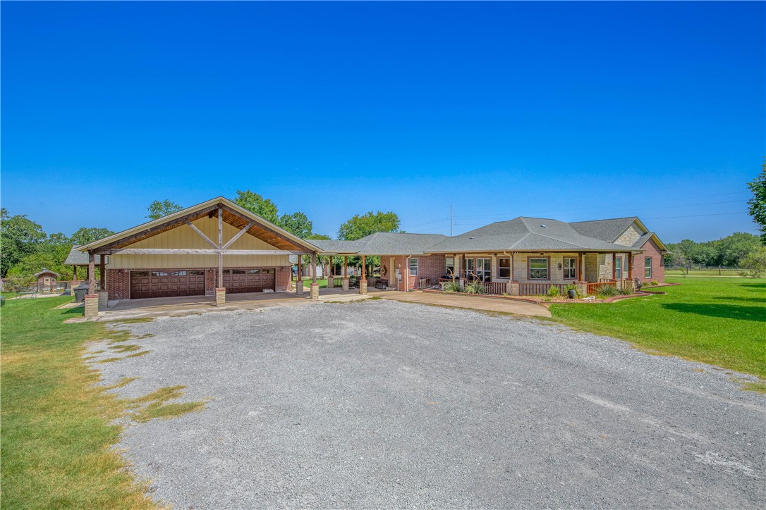 6045 Old Reliance Road Bryan, TX 77808 - Photo 6 of 50 a view of an house with backyard and garden