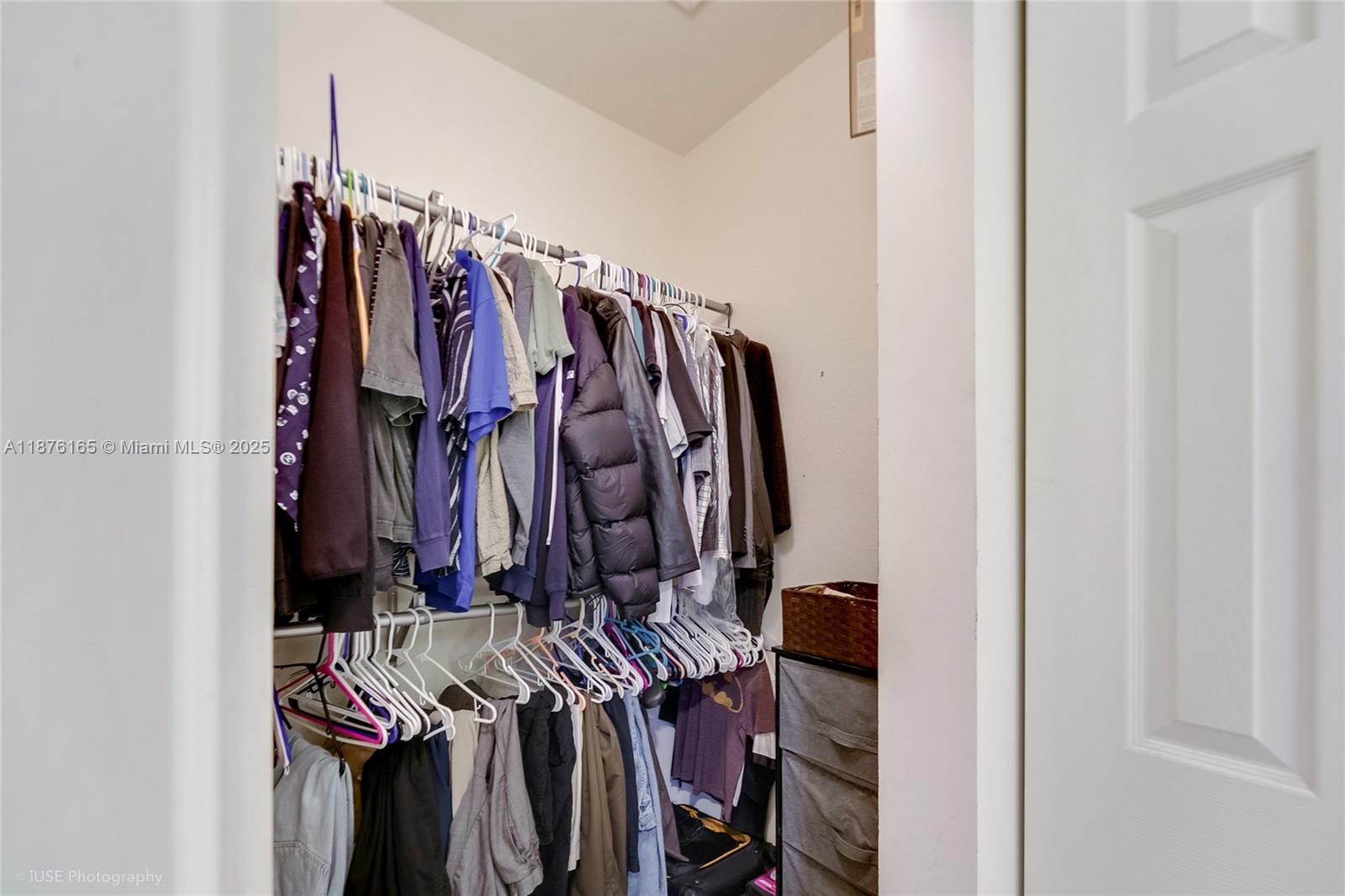 1433 Southeast 20th Road Homestead, FL 33035 - Photo 14 of 19 a view of walk in closet with clothes