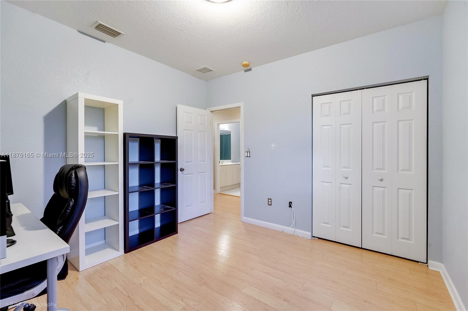 1433 Southeast 20th Road Homestead, FL 33035 - Photo 16 of 19 a view of a bedroom with furniture and closet