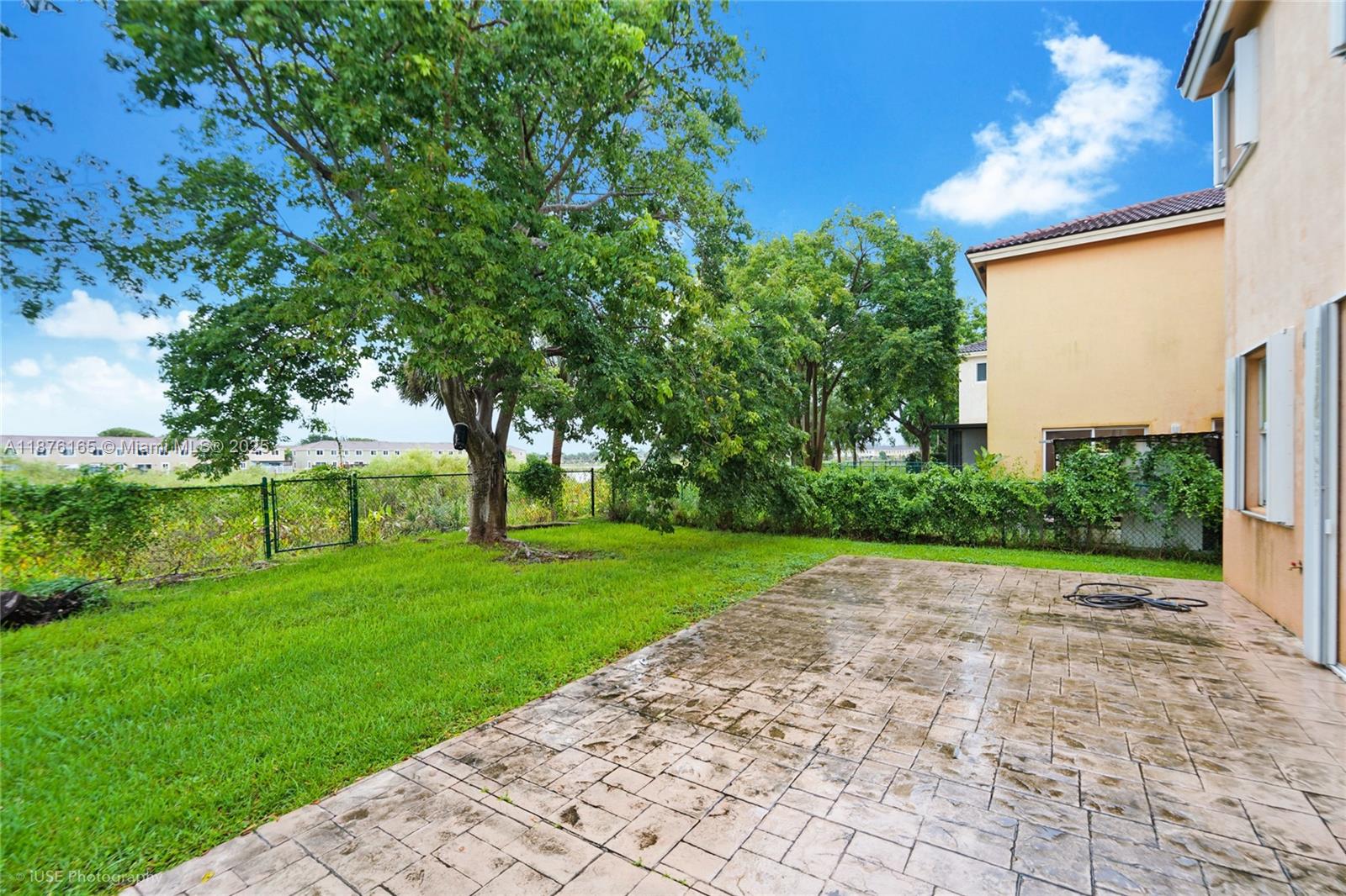 1433 Southeast 20th Road Homestead, FL 33035 - Photo 18 of 19 a view of a backyard with large trees