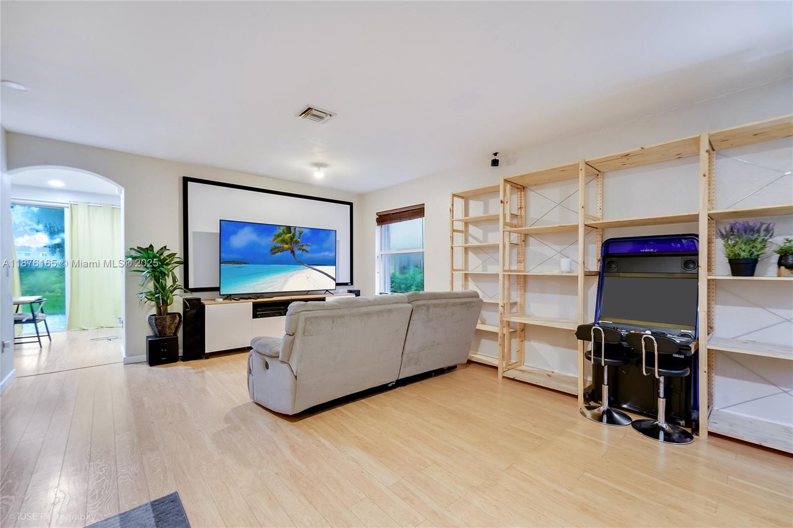 1433 Southeast 20th Road Homestead, FL 33035 - Photo 5 of 19 a living room with furniture and a flat screen tv