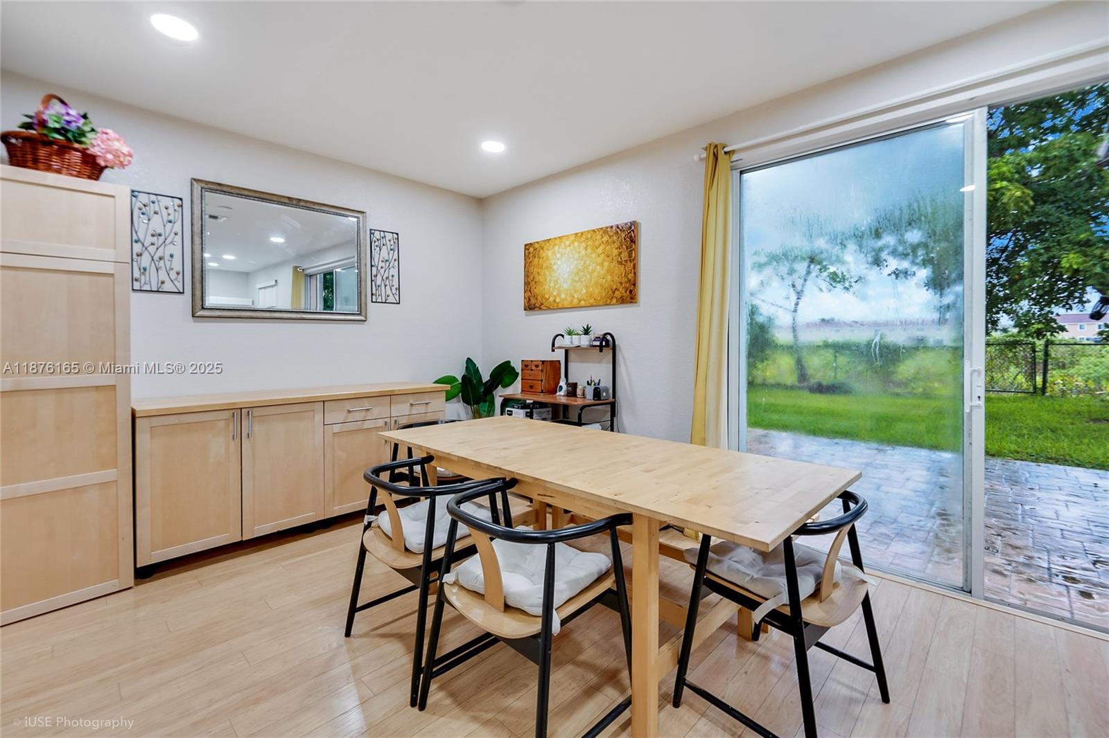 1433 Southeast 20th Road Homestead, FL 33035 - Photo 7 of 19 a view of a dining room with furniture window and wooden floor