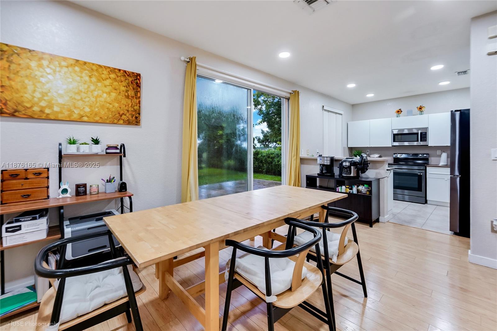 1433 Southeast 20th Road Homestead, FL 33035 - Photo 8 of 19 a view of a dining room with furniture a rug and wooden floor