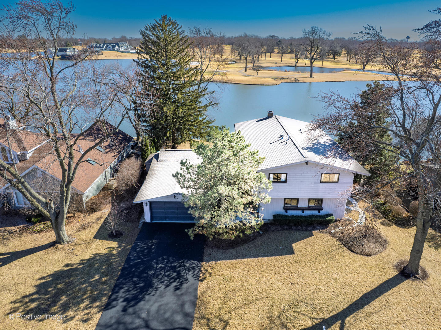 644 West 58th Street Hinsdale, IL 60521 - Photo 2 of 2 a view of a house with a yard covered with snow in the background
