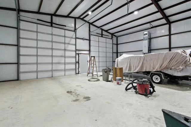 a view of parking garage with cars